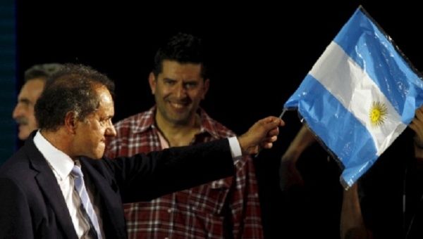 Left-leaning ruling party candidate Daniel Scioli is to be Argentina's next president, according to polls.