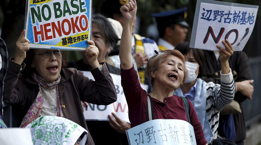 People protest the planned relocation of the U.S. military base, to Okinawa's Henoko coast, at a rally in front of Prime Minister Shinzo Abe's official residence.