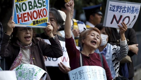 People protest the planned relocation of the U.S. military base, to Okinawa's Henoko coast, at a rally in front of Prime Minister Shinzo Abe's official residence.