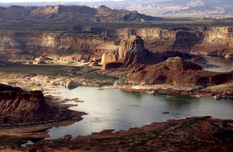 Huge areas of dry ground which would be under water when the lake is full are seen at Lake Powell.