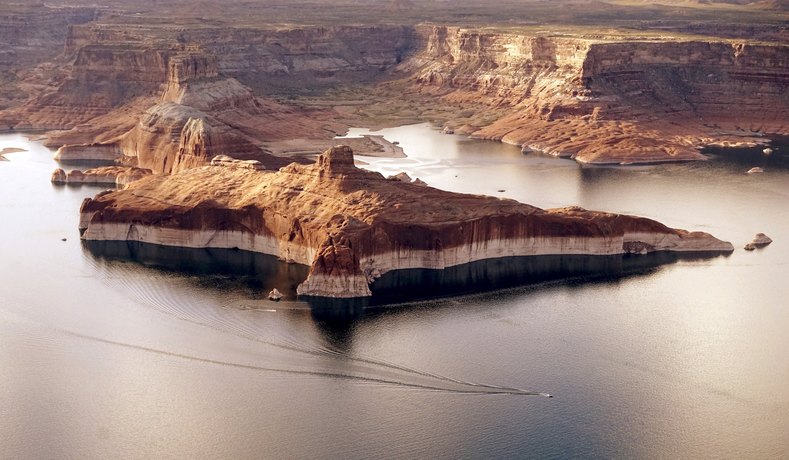 Huge areas of dry ground (background) which would be under water when the lake is full are seen.