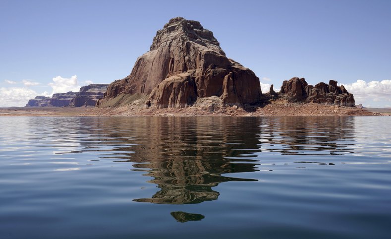 Gregory Butte is reflected in the Arizonan lake.