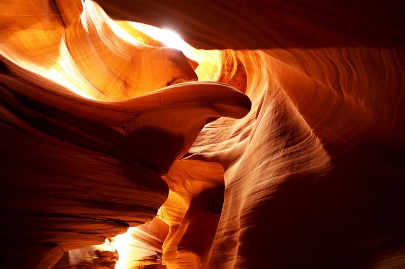 Sandstone sculpted by water and wind erosion is seen in a slot canyon, one of hundreds that surround Lake Powell.