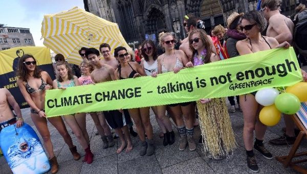 Greenpeace activists in Cologne, western Germany, on November 28, 2015 