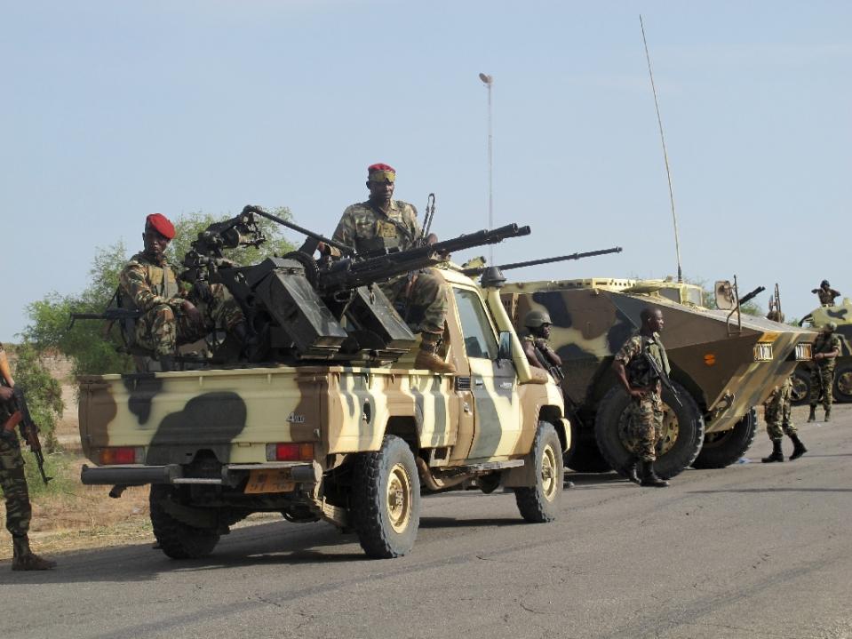 A convoy of Cameroon soldiers passes through the northern town of Dabanga as part of a raid against Nigerian Islamist group Boko Haram, Jun. 2014