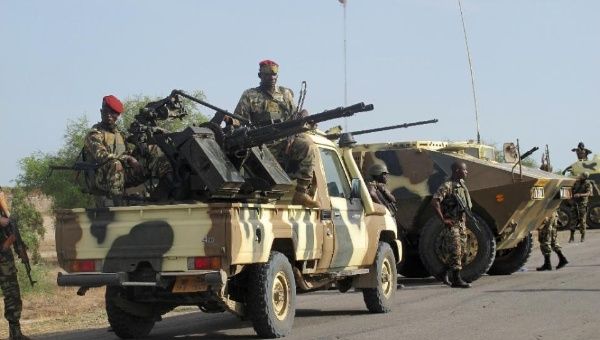 A convoy of Cameroon soldiers passes through the northern town of Dabanga as part of a raid against Nigerian Islamist group Boko Haram, Jun. 2014