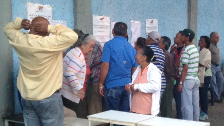 Elderly voters queue up outside a voting station in Caracas.