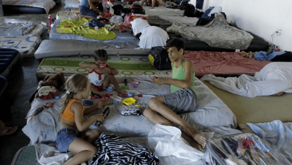 Children play at a shelter for Cuban migrants in the border between Panama and Costa Rica in Paso Canoas, Panama Dec. 23, 2015.