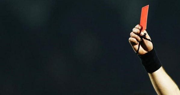 Referee Laurent Duhamel shows a red card to Maxime Poundje of Girondins Bordeaux during his French Ligue 1 soccer match against Toulouse, Jan. 11, 2014.