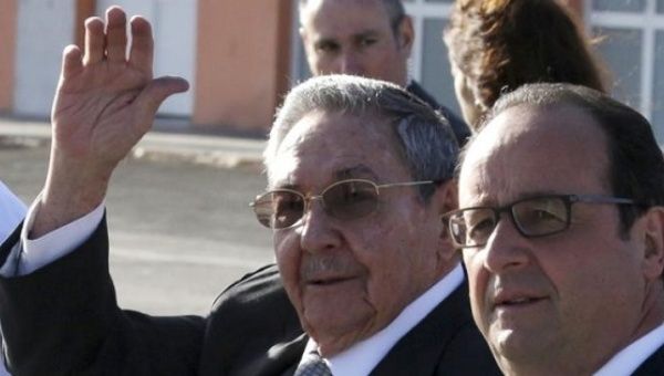 Cuban President Raul Castro with his French counterpart Francois Hollande as the latter landed in Cuba for an official visit in May 2015.