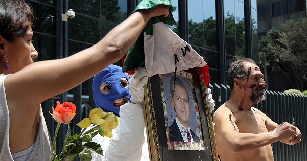 Anti-torture activists protest in front of the Office of the Attorney General of the Republic, Mexico City, June 26, 2015.