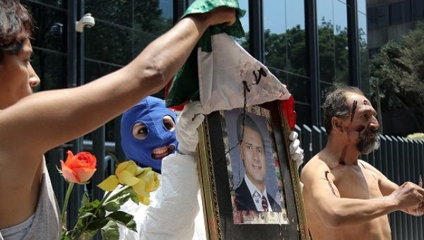 Anti-torture activists protest in front of the Office of the Attorney General of the Republic, Mexico City, June 26, 2015.