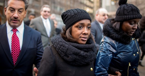 Akai Gurley's partner Kimberly Ballinger exits after speaking to the media following an arraignment hearing in New York City on Feb. 11, 2016.