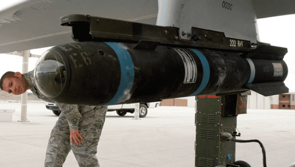 A U.S. Hellfire Missile strapped to a military jet.