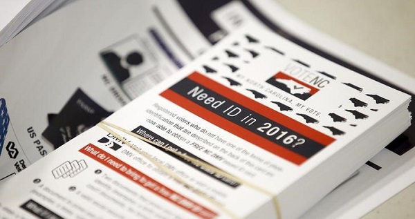 Flyers informing voters of the new voter ID law that will go into effect for the 2016 election, in Charlotte, North Carolina.