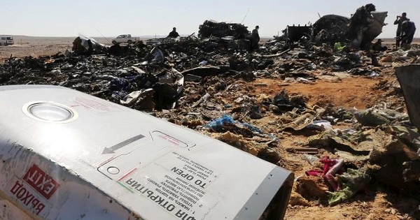 The remains of a Russian airliner are inspected by military investigators at the crash site at the al-Hasanah area in El Arish city, north Egypt, Nov. 1, 2015.