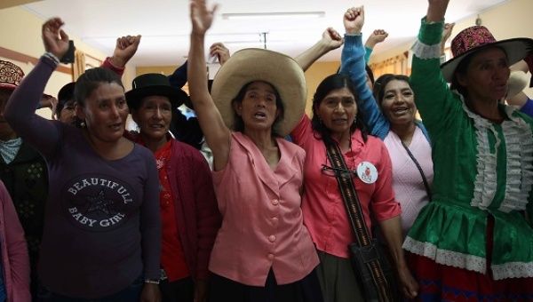 Representatives of Peruvian women's groups for victims of forced sterilization shout slogans after a meeting on Dec. 10, 2015.