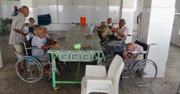 Elderly residents of a home sit in the dining hall after it was attacked by gunmen in the Yemeni port town of Aden March 4, 2016.