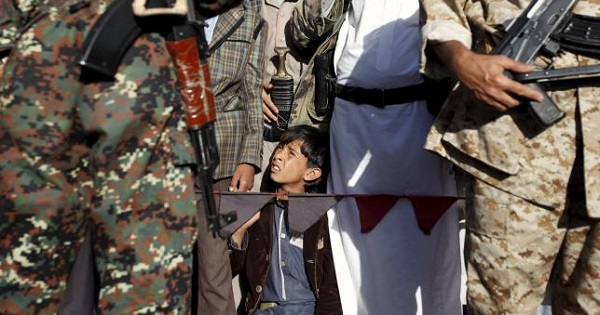 A young child looks on as he takes part in a demonstration against Saudi-led strikes in Yemen's capital Sanaa on Nov. 20, 2015.