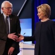 Sanders and Clinton stand on the podium at Wednesday's debate in Florida, March 9, 2016.