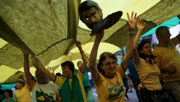 Demonstrators attend a protest against Brazil's President Dilma Rousseff, part of nationwide protests calling for her impeachment, in Sao Paulo, Brazil, March 13, 2016.