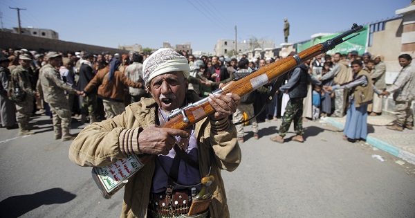 A Houthi militant carries his weapon during a funeral, Sanaa, Feb. 18, 2016.