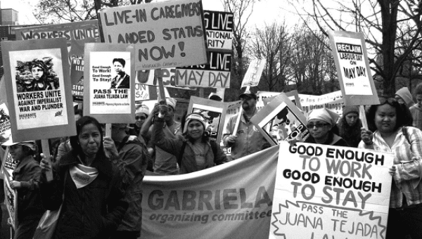 Activist demand changes to Canadian immigration policy during the May Day protest in Toronto, Canada, in 2009.