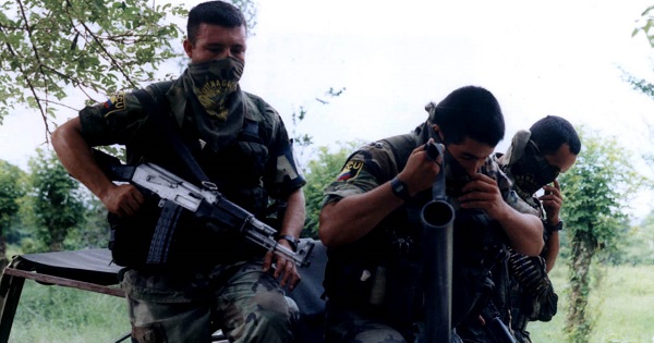 Members of the now demobilized United Self-Defese Forces of Colombia, one of the country's most notorious paramilitary groups, appear in this file photo from Nov. 11, 2004.