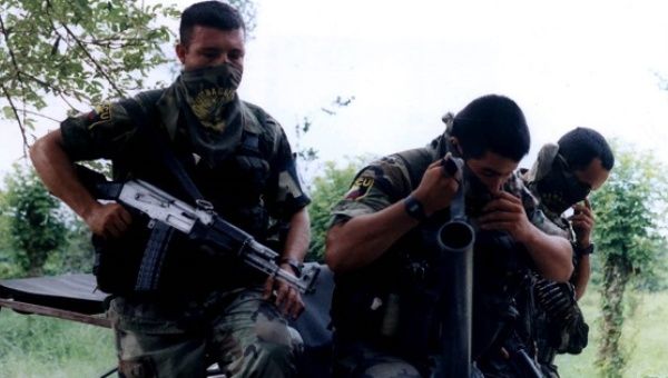 Members of the now demobilized United Self-Defese Forces of Colombia, one of the country's most notorious paramilitary groups, appear in this file photo from Nov. 11, 2004.