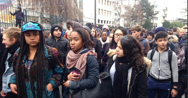 Students walk toward the police station protesting against the brutal arrest of a teen.