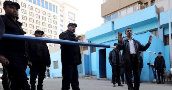 Policemen guard in front of a morgue where the body of an Italian Giulio Regeni is kept in Cairo, Egypt, Feb. 4, 2016.