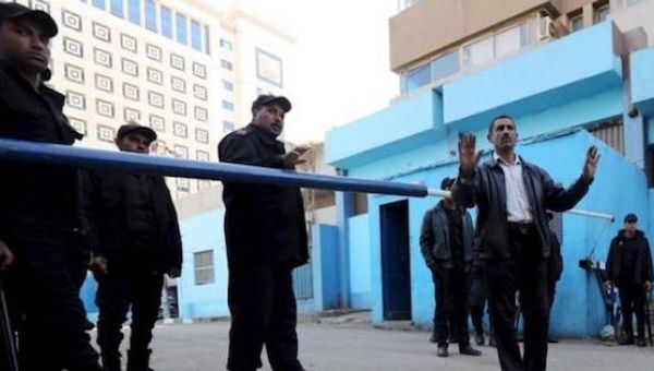 Policemen guard in front of a morgue where the body of an Italian Giulio Regeni is kept in Cairo, Egypt, Feb. 4, 2016.