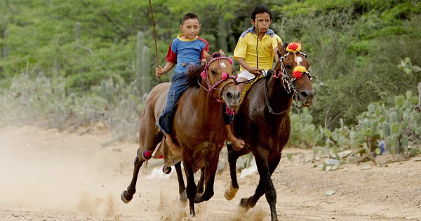 Two children compete in a horse race during the 21st Festival of Wayuu Culture, La Guajira, Colombia, June 10, 2007.