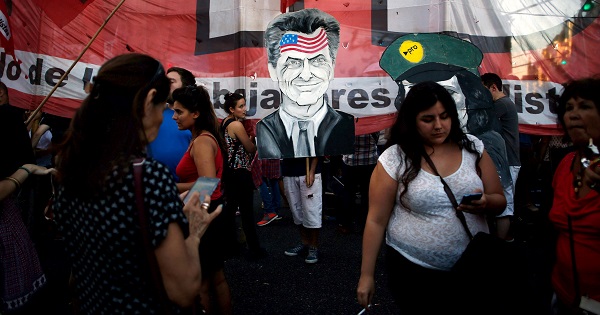 A protest sign depicts President Mauricio Macri during a demonstration against a settlement with holdout creditors in Buenos Aires, March 15, 2016.