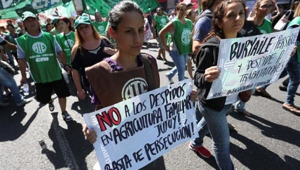 Protesters march against mass layoffs in Argentina under President Mauricio Macri, March 29, 2016.