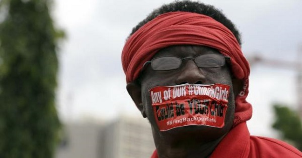 Protester in Nigeria demands the government to stop Boko Haram abductions and rescue the 219 girls still abducted by the extremist group.