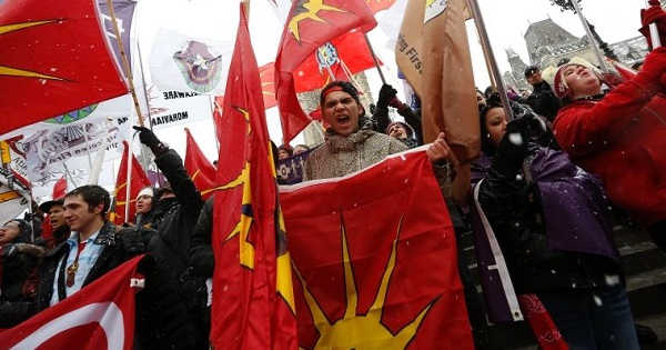 First Nations protesters hold flags during a demonstration as part of the Idle No More movement on Parliament Hill in Ottawa, Canada, Dec. 21, 2012.