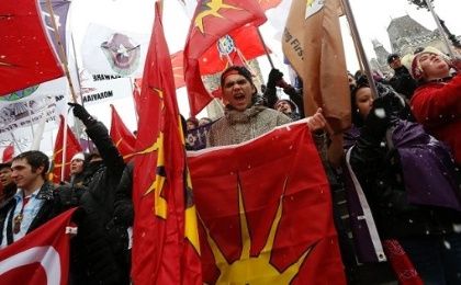 First Nations protesters hold flags during a demonstration as part of the Idle No More movement on Parliament Hill in Ottawa, Canada, Dec. 21, 2012. 