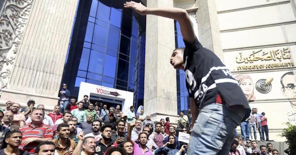 Egyptian activists shout slogans against President Abdel Fattah al-Sisi during a demonstration.