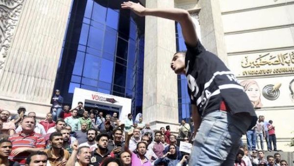  Egyptian activists shout slogans against President Abdel Fattah al-Sisi during a demonstration.