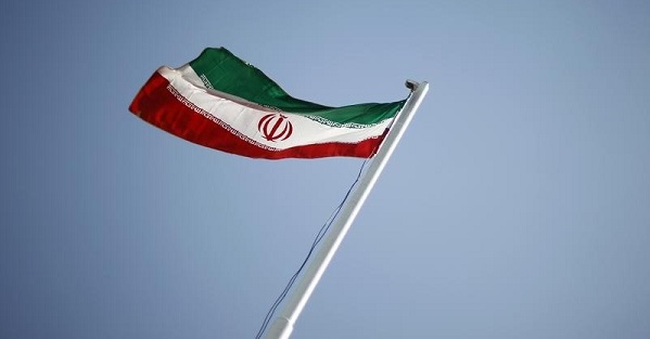 An Iranian national flag flutters during the opening ceremony of the 16th International Oil, Gas & Petrochemical Exhibition in Tehran.