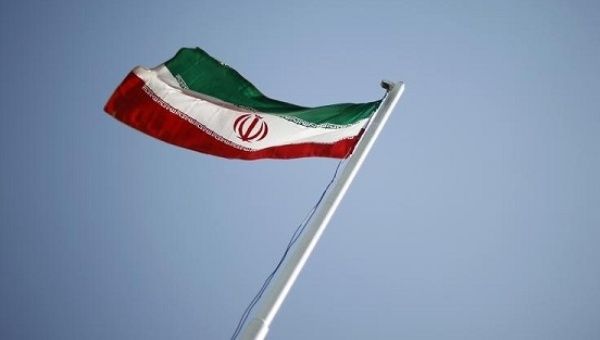 An Iranian national flag flutters during the opening ceremony of the 16th International Oil, Gas & Petrochemical Exhibition in Tehran.