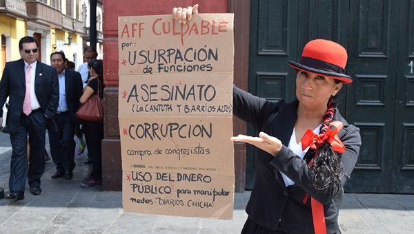 Protestor lists the crimes of Alberto Fujimori