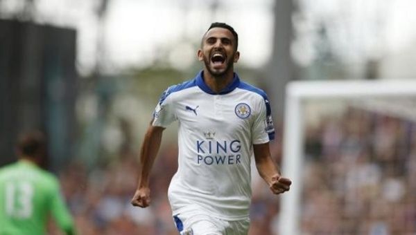 Riyad Mahrez celebrates scoring a goal for Leicester.