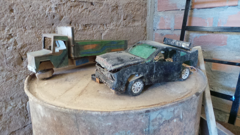 Esteban and his father made these toy cars from discarded rubbish when he was a young boy.