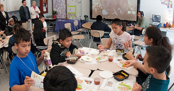 Children eating a meal as part of the School Lunch program at a classroom in Maryland.