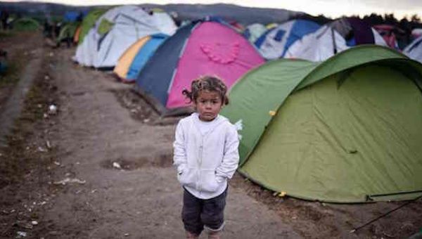 A child stands in the makeshift camp at the Greek-Macedonian border where thousands of people are stranded. 