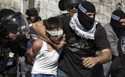 Israeli police detain a Palestinian child in Jerusalem. 