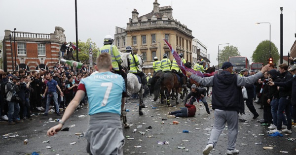 West Ham Fans clash with police ahead of the match.