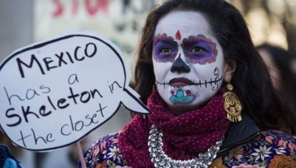 A demonstrator in London protests Mexican state violence during a visit of Mexico's President Enrique Peña Nieto to Britain, March 3, 2015.